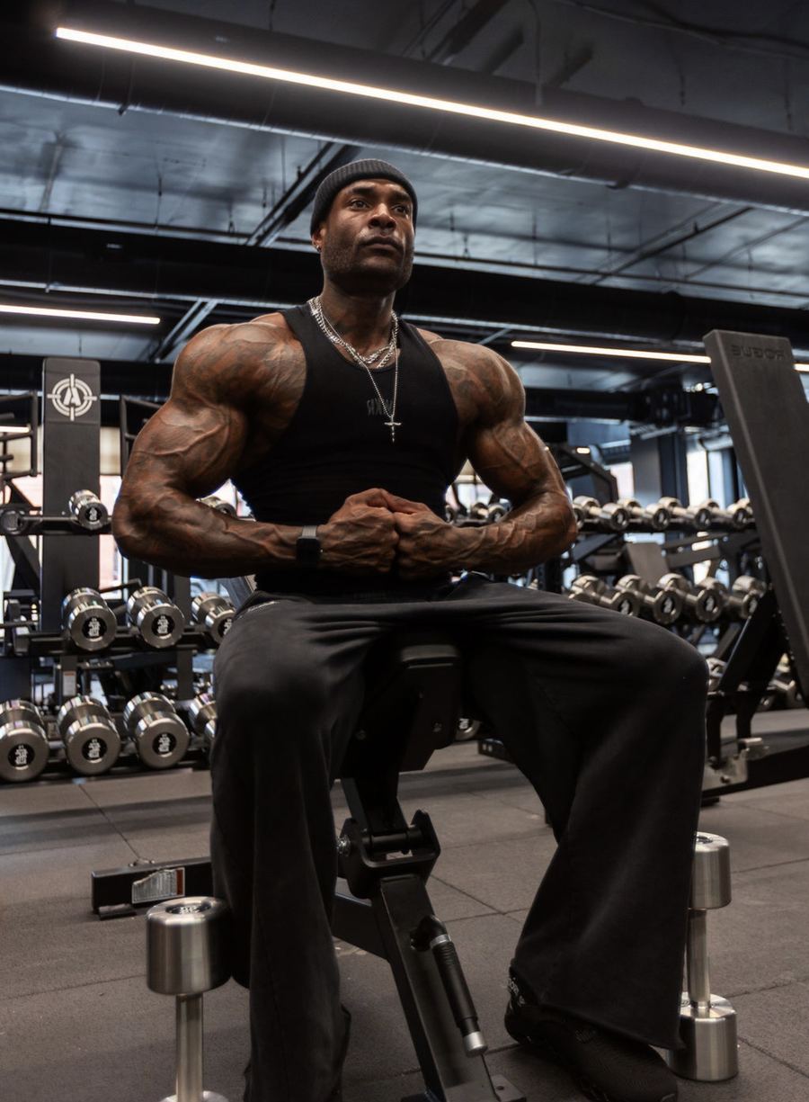 Coach Jae seated in the gym